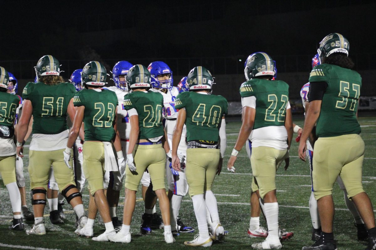 The Dons line up to shake hands with The Royals postgame. Image Credit: Ethan Maday