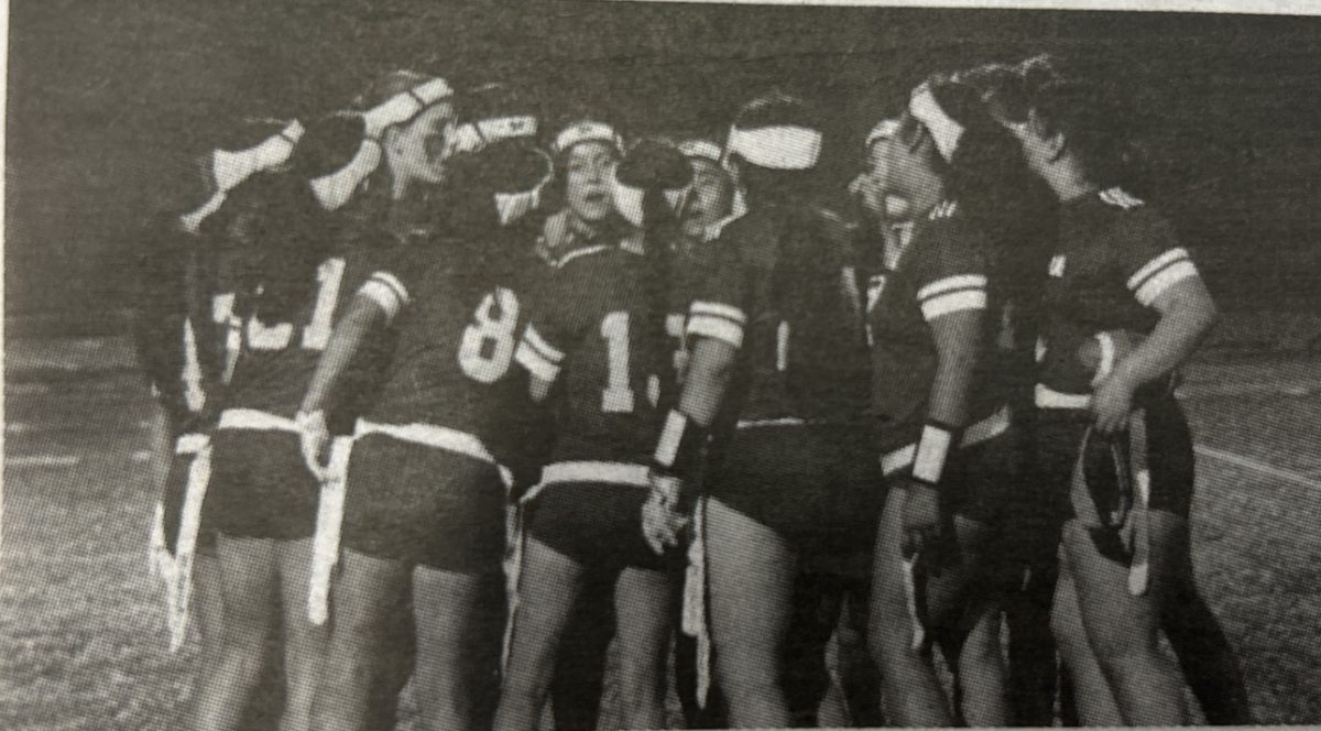 The girls flag football team huddles together. Courtesy of: Audrina Pineda