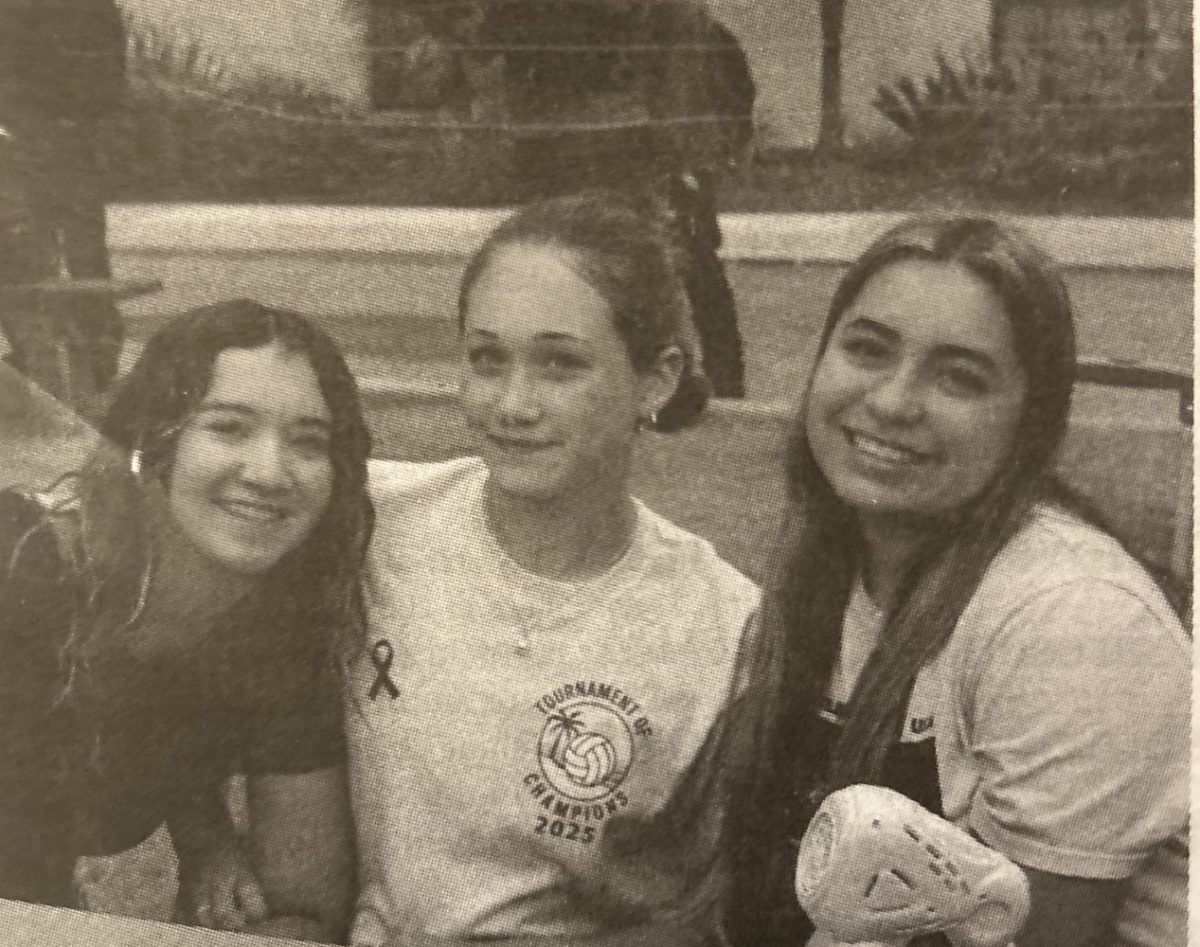 Mental Health Awareness club members, Lua Morancey, Jules Horton, and Yesenia Dunn pose while students sign up. Image Credit: Kiki Oser