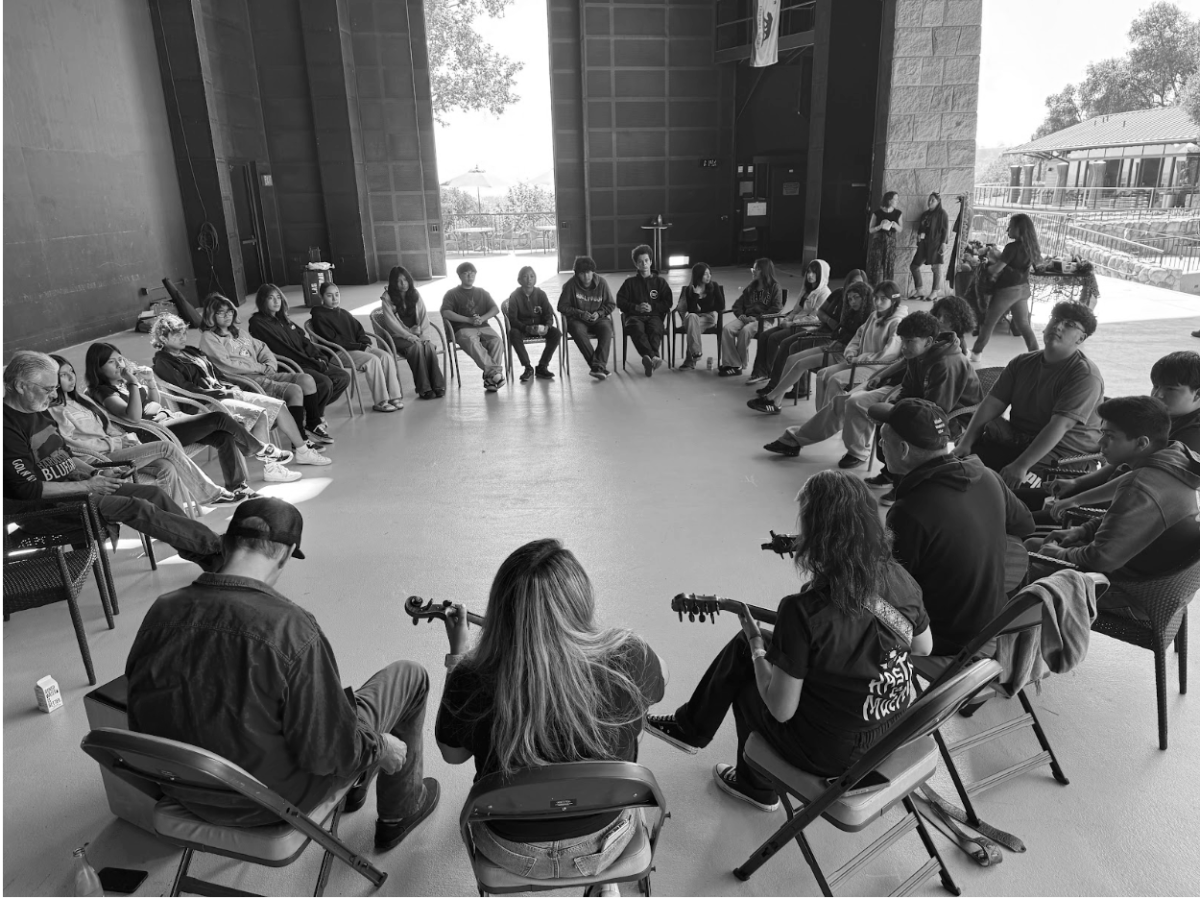 Ethnic Studies students speak to Las Cafeteras backstage. Image Credit: Joseph Velasco 