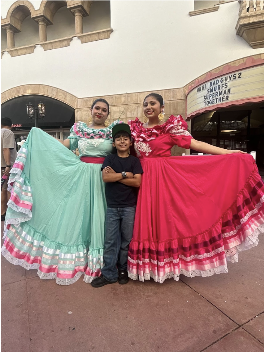 Senior Angie Pacheco (right) and freshman Mia Pacheco (left) get ready to perform a traditional Jalisco Folklórico dance at Paseo Nuevo during Fiesta.
Image courtesy of Angie Pacheco
