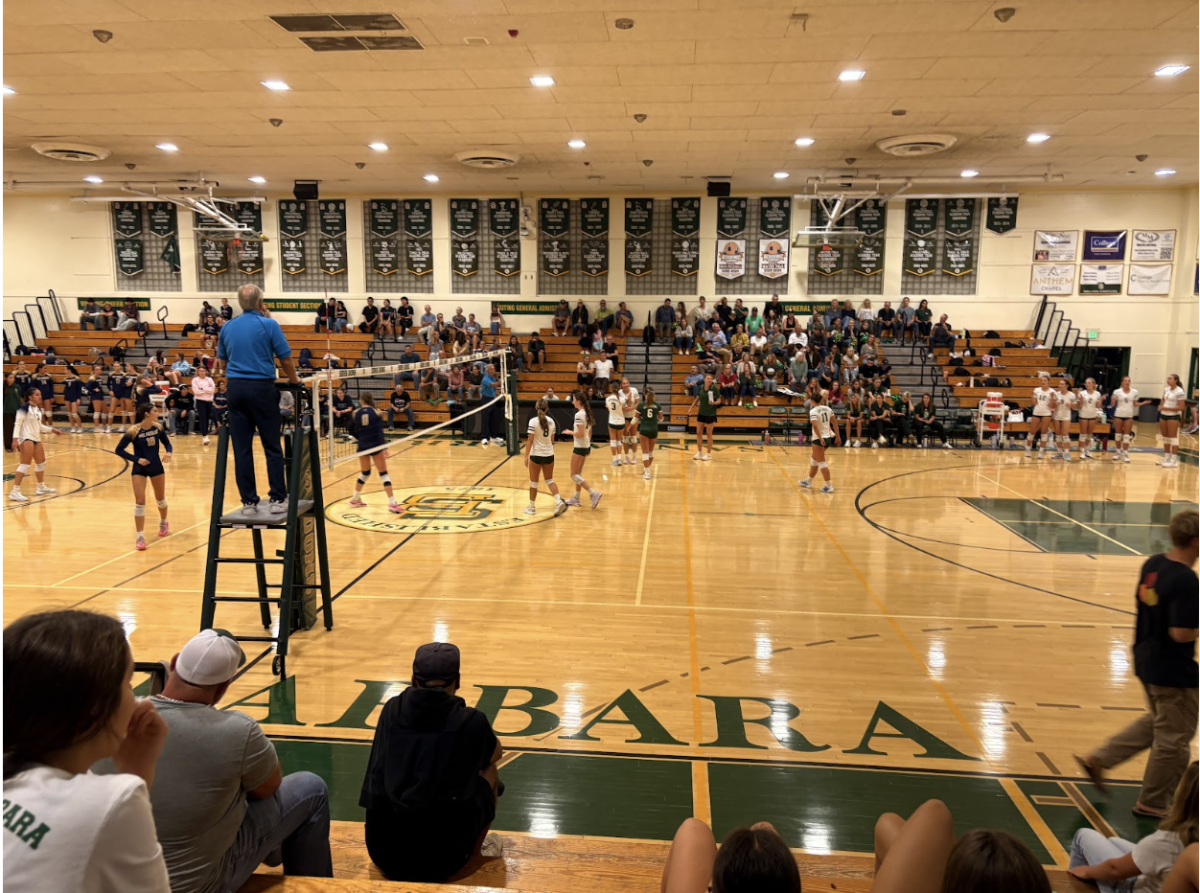 The varsity team celebrates in between scoring a point, keeping the energy high during their match against Dos Pueblos. 
Image credit: Ingrid Ellis