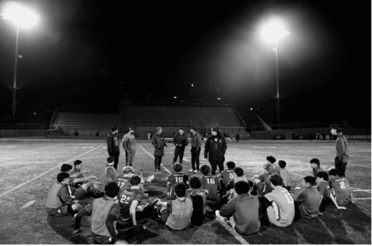 The soccer team gathers around for critiques from their coaches, Image courtesy of: SBHS Yearbook