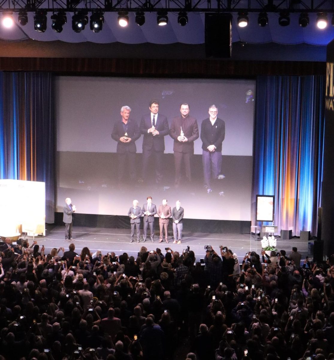 Hammond Cinema Vanguard Awardees Penn, Del Toro and DiCaprio stand with One Battle After Another director Paul Thomas Anderson, holding their trophy. Photo Credit: Ethan Maday