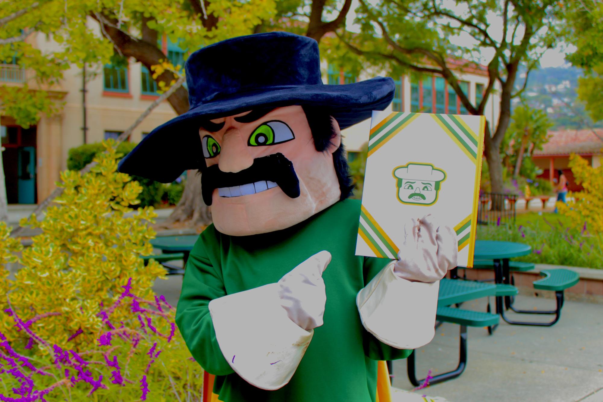 The Don mascot with the #LikeaDon yearbook. Photo by Angie Pacheco for yearbook.
