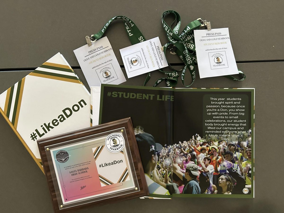 An image of the SBHS Olive and Gold Yearbook's award and a highlight page. Photo by Forge Staff.