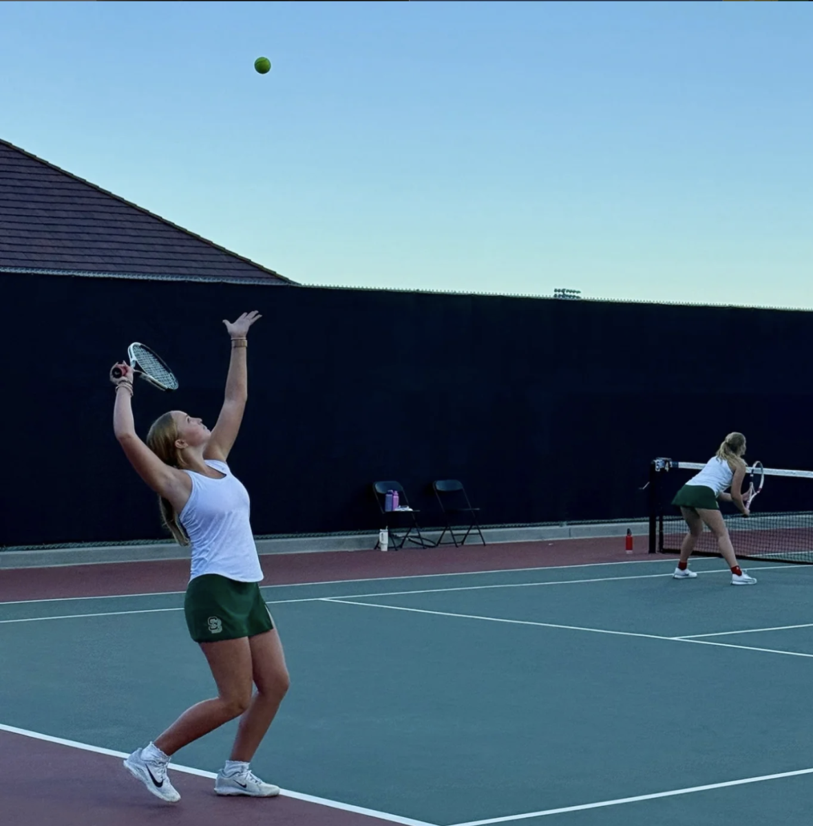 Kana Wolf with her doubles partner Violet Marr at a game. Photo from SBHS Girls Tennis instagram.