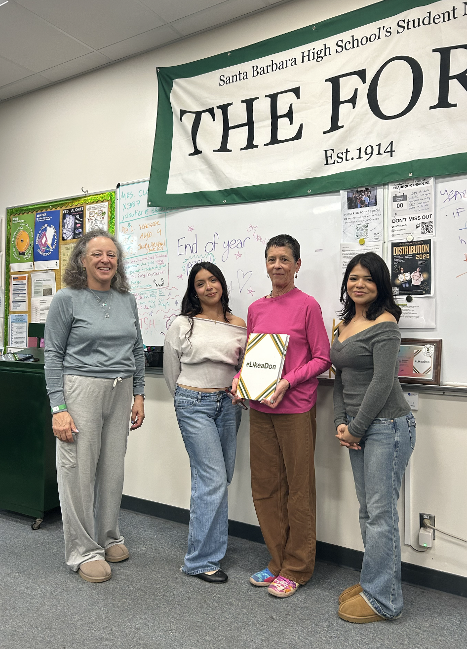 Mrs. Light stands with Yearbook Adviser Joanne Liskin Cloutier and yearbook staff. Photo credit: Hope Smith